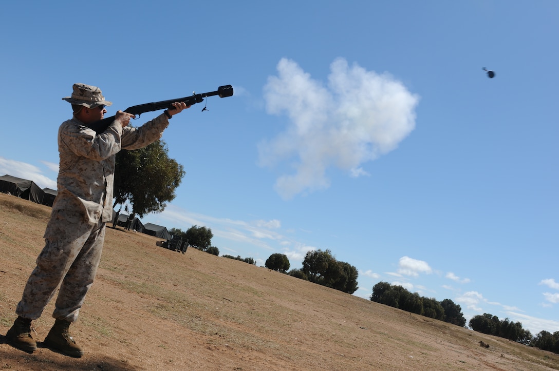 Staff Sgt. Michael Rice, a military police platoon sergeant for the 471st Marine Wing Support Squadron, and native of St. Louis, Mo., launches a dummy grenade from a Mossberg M500 with a grenade launching cup attachment during peace support operations training in Tifnit, Morocco April, 7-18. The training is part of the African Lion 2012 exercise. African Lion is an annual, bilateral training exercise between U.S. and Moroccan forces promoting interoperability and security cooperation.
